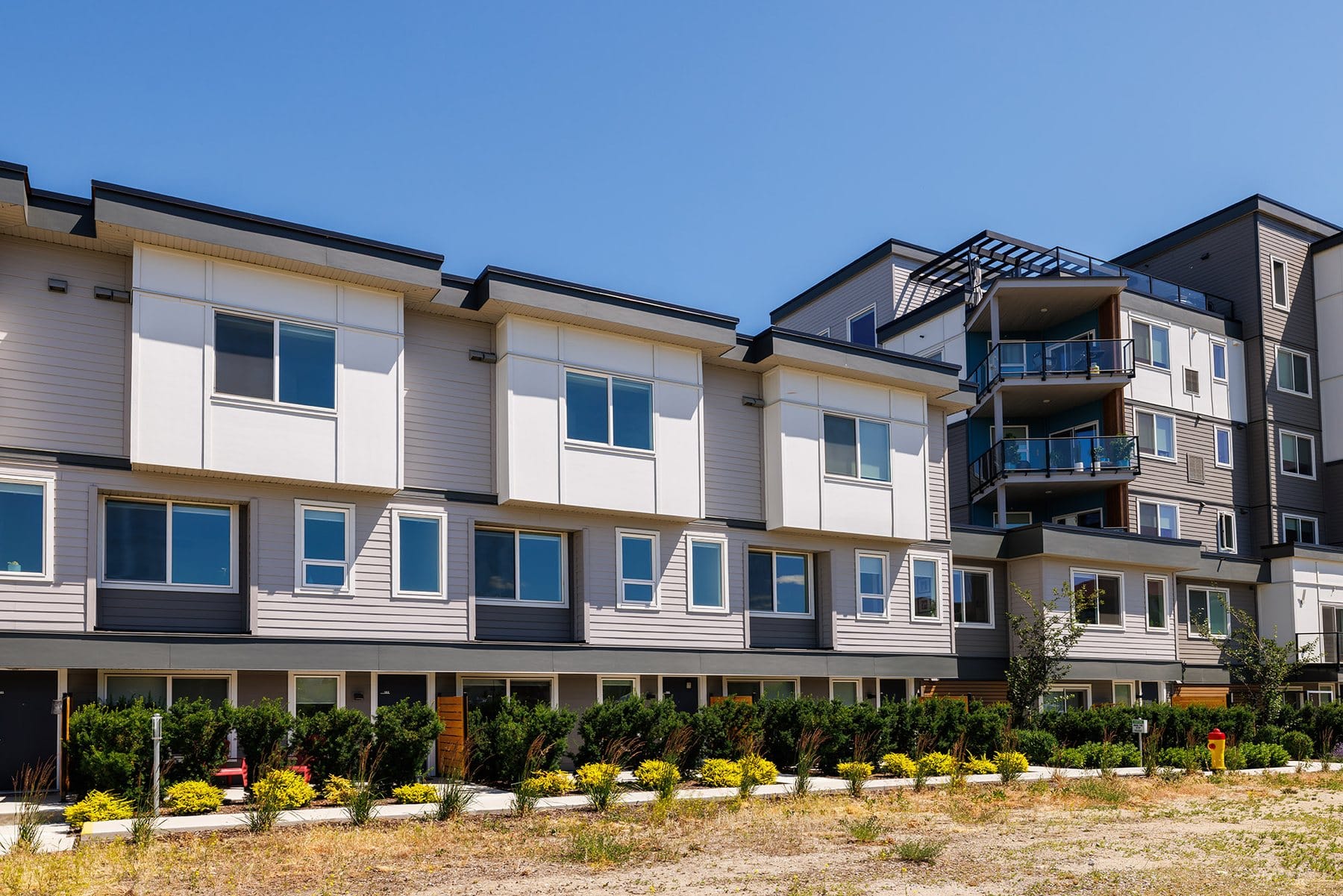 The townhome row with the 3642 tower behind