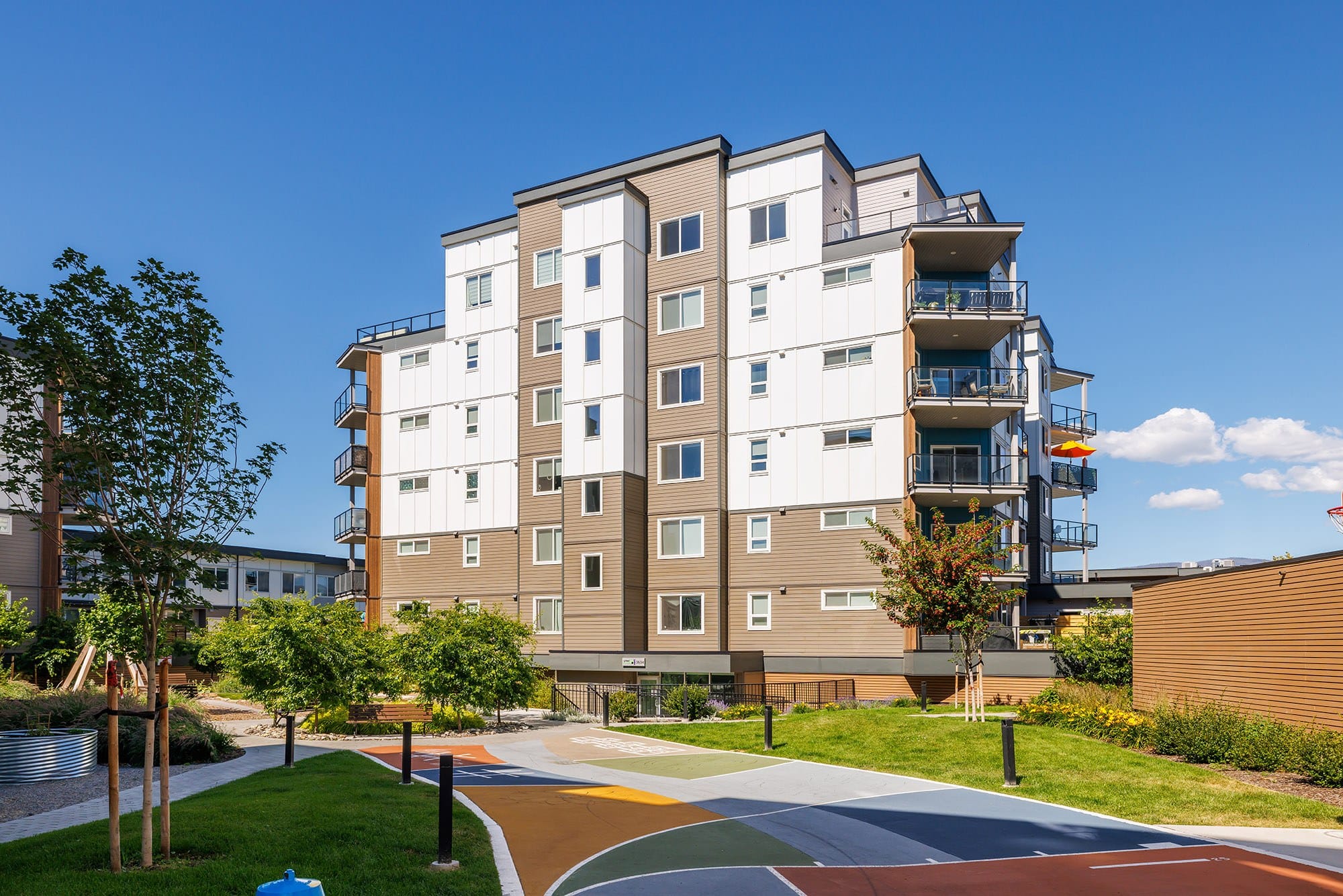 The 3634 building at Green Square Vert from the courtyard, the penthouse deck on top