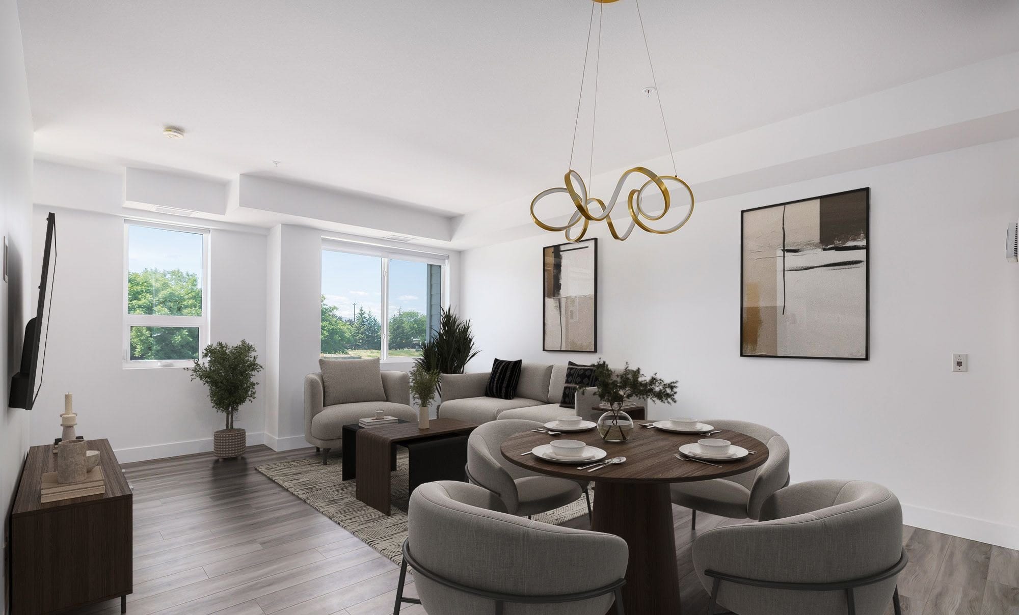 The main floor of the townhome, virtually staged, with the dining table under the pendant and the sofa by the windows over the park