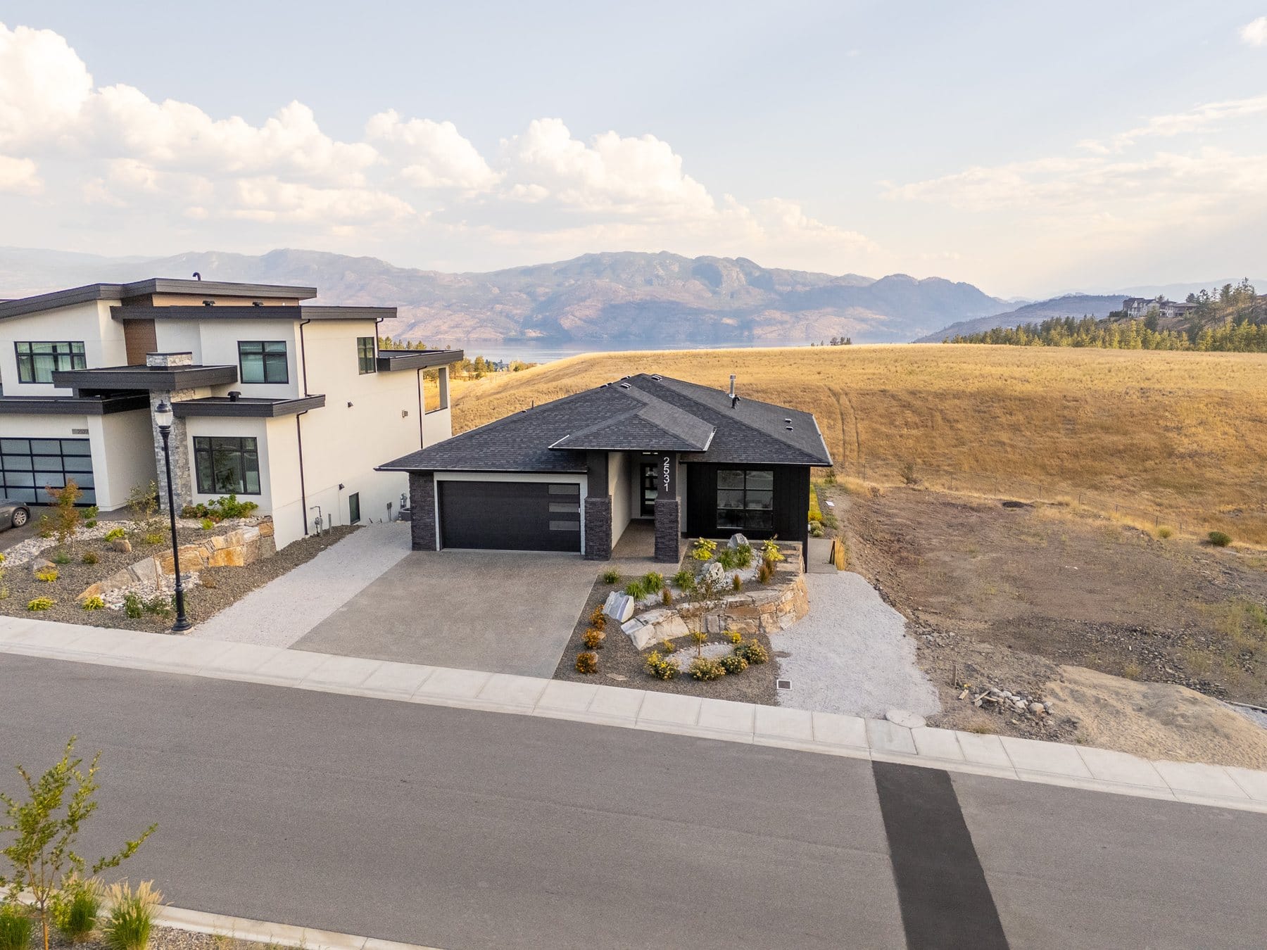 2531 Pinnacle Ridge Drive, a finished home on the same Tallus Ridge street as Lot 34, with Okanagan Lake behind