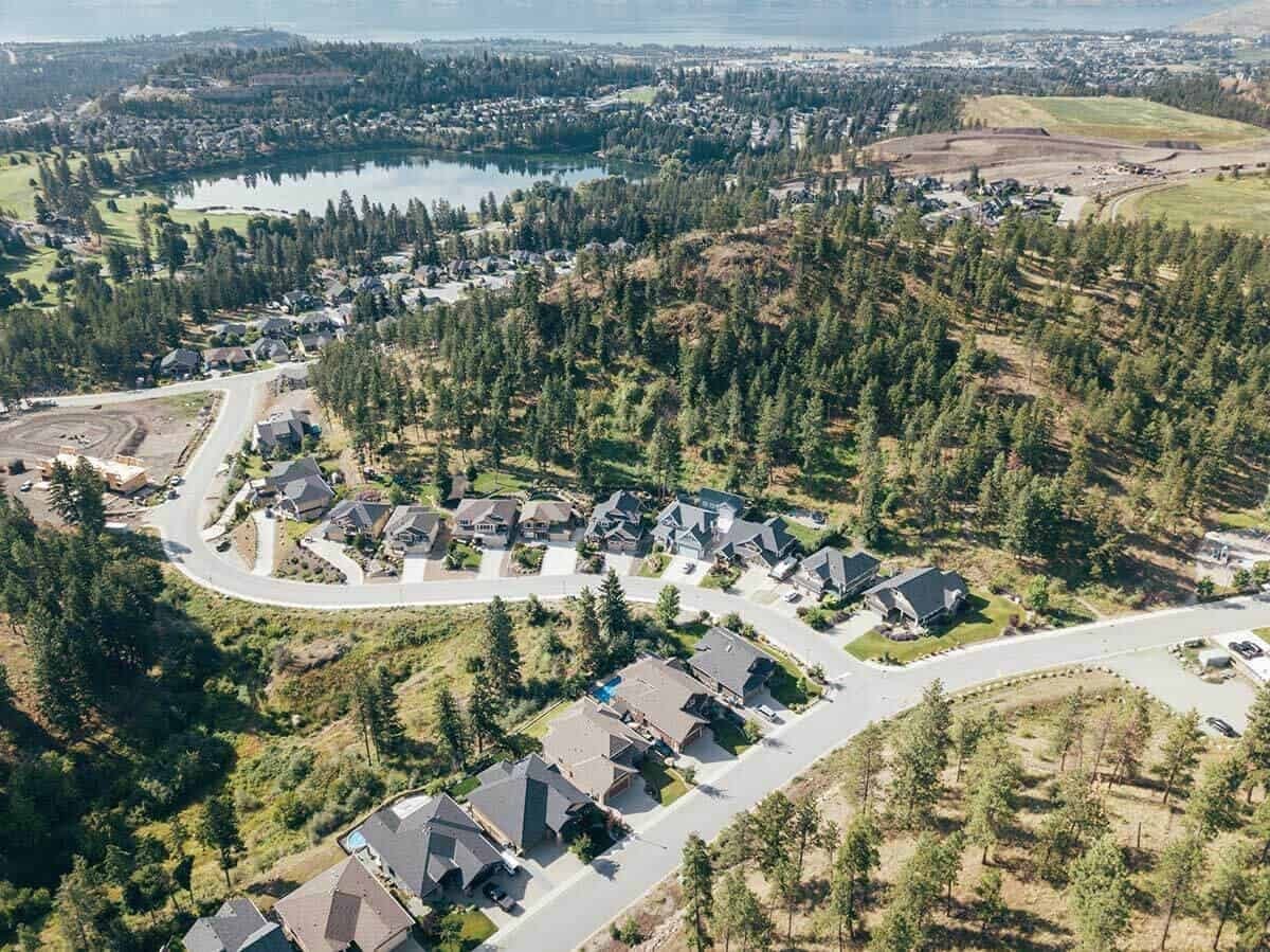 Homes on the ridge with Okanagan Lake beyond