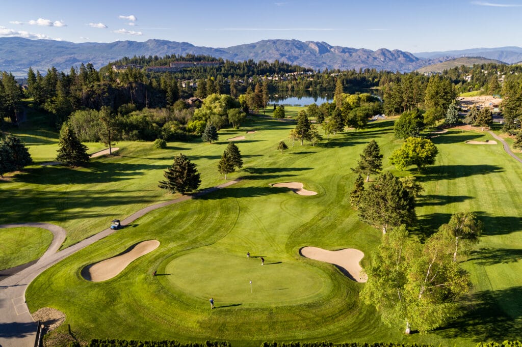A green at Shannon Lake Golf Club, with the lake behind it