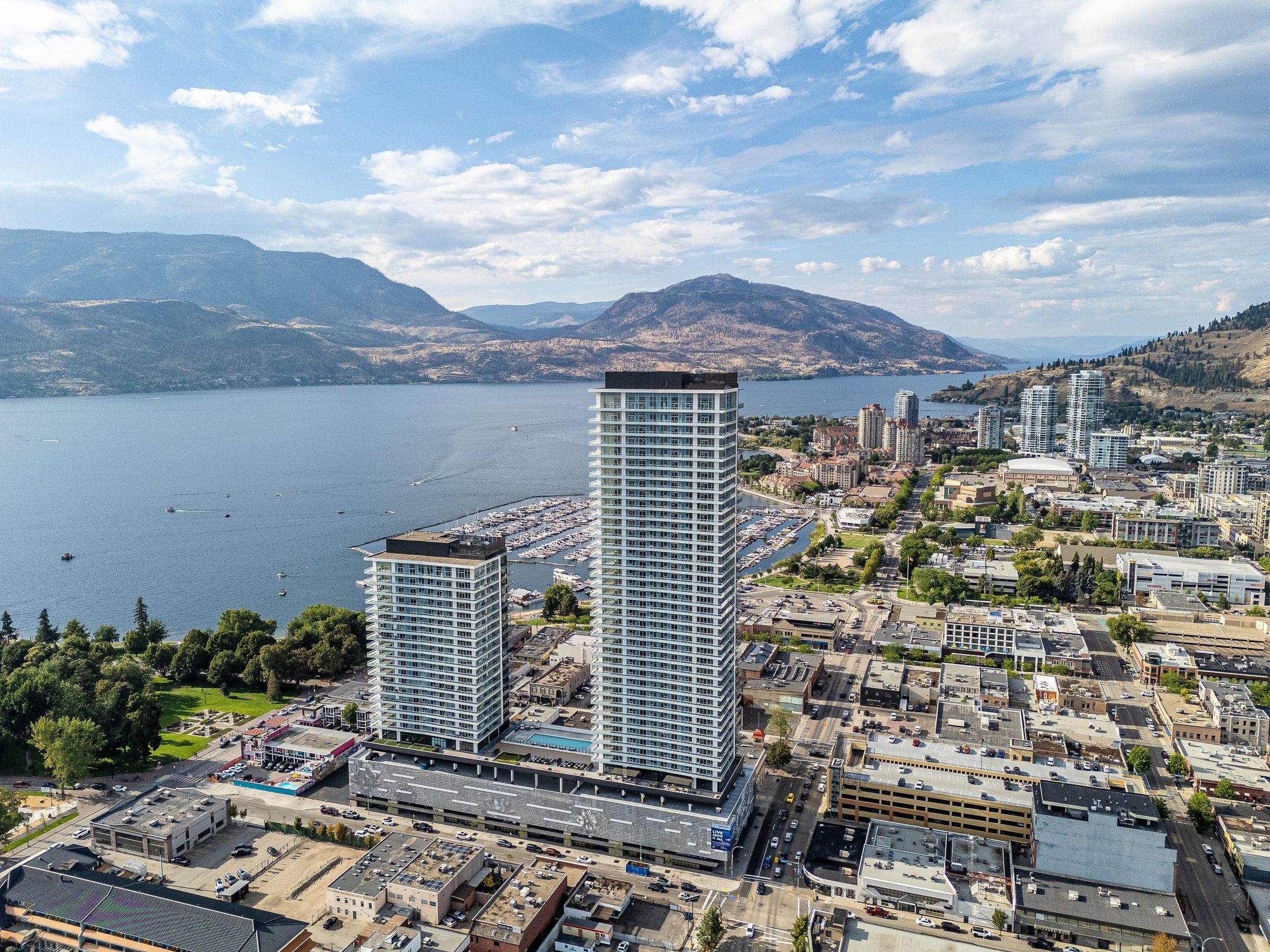 Okanagan Lake and the bridge behind the two towers, with City Park at their feet